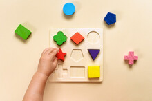 The Child Collects A Multicolored Sorter. Educational Logic Toy For Kid's