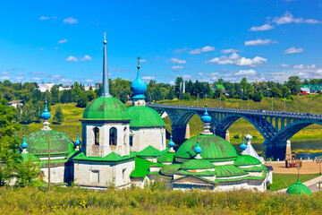 Wall Mural - Church of the Nativity of the Holy Theotokos (Church of Saint Paraskevi of Iconium, also known as Paraskeva Pyatnitsa) and view of bridge across Volga River. Staritsa, Tver Region, Russia