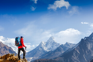 Hiker on the top in Himalayas mountains. Travel sport lifestyle concept