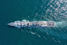 Aerial View Of Naval Ship, Battle Ship, Warship, Military Ship Resilient And Armed With Weapon Systems, Though Armament On Troop Transports. Support Navy Ship. Military Sea Transport.