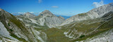 Fototapeta Niebo - Pizzo Intermersoli, Mount Corvo, Corno Piccolo and Corno Grande panoramic view on a trekking summer day in Campo Imperatore, Gran Sasso, Abruzzo, Italy