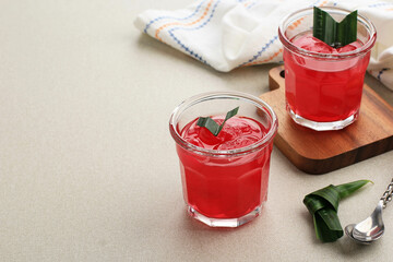 Manisan Kolang-Kaling or preserved sugar palm fruit, tinted red, a traditional Indonesian typical refreshment and dessert during Ramadan month and in Idul Fitri or Hari Raya.