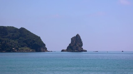 Sticker - Ortholithi rock in Pentati seen from Ionian Sea beach in Agios Gordios town on a Greek Island of Corfu, 4k video