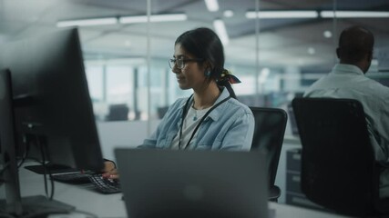 Diverse Office: Portrait of Talented Indian Girl IT Programmer Working on Desktop Computer in Friendly Multi-Ethnic Environment. Female Software Engineer Wearing Glasses Develop Inspirational App