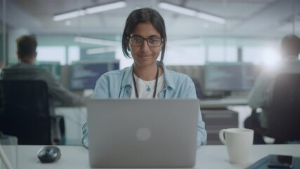Diverse Office: Portrait of Smiling Indian IT Programmer Working on Desktop Computer. Female Specialist Create Innovative Software. Professional Engineer Develop App. Front View Zoom In