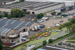 Diksmuide, Flanders, Belgium - August 3, 2021: Aerial view on canoe producing and renting out business along Yser river in industrial zone, SE from IJzertoren.