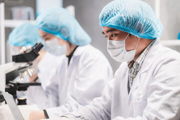 Wall Mural - health care researchers working in life science laboratory, medical science technology research work
