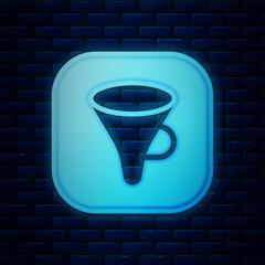 Poster - Glowing neon Funnel or filter icon isolated on brick wall background. Vector