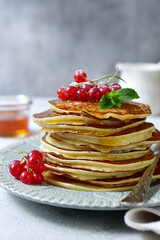 Wall Mural - Delicious hot pancakes with fresh berries and maple syrup for a breakfast.