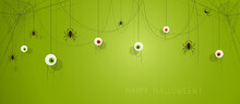 Green Halloween Banner With Eyes And Spiders