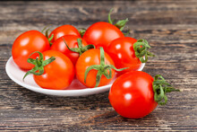 Red Ripe Tomatoes On A Plate