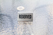 Reserved iron sign on table. Reservation table in a restaurant. Hungry.