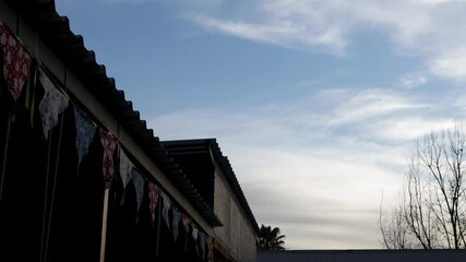 Wall Mural - timelapse of clouds and playground flags