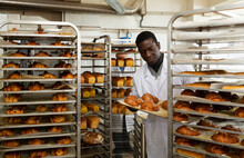 African-american Lay Out Over Trolley Fresh Pastries
