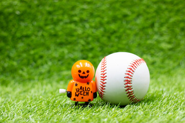 Wall Mural - Baseball for Halloween Day on green grass with ghost