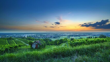 Wall Mural - Time-lapse shot of fields and houses in a small German town from sunset to night