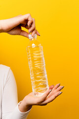 hand and water bottle close-up of hands and water bottle clean drinking water concept drinking clean water Adequate water consumption per day