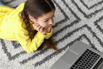 Sticker - Cute girl watching cartoons at home