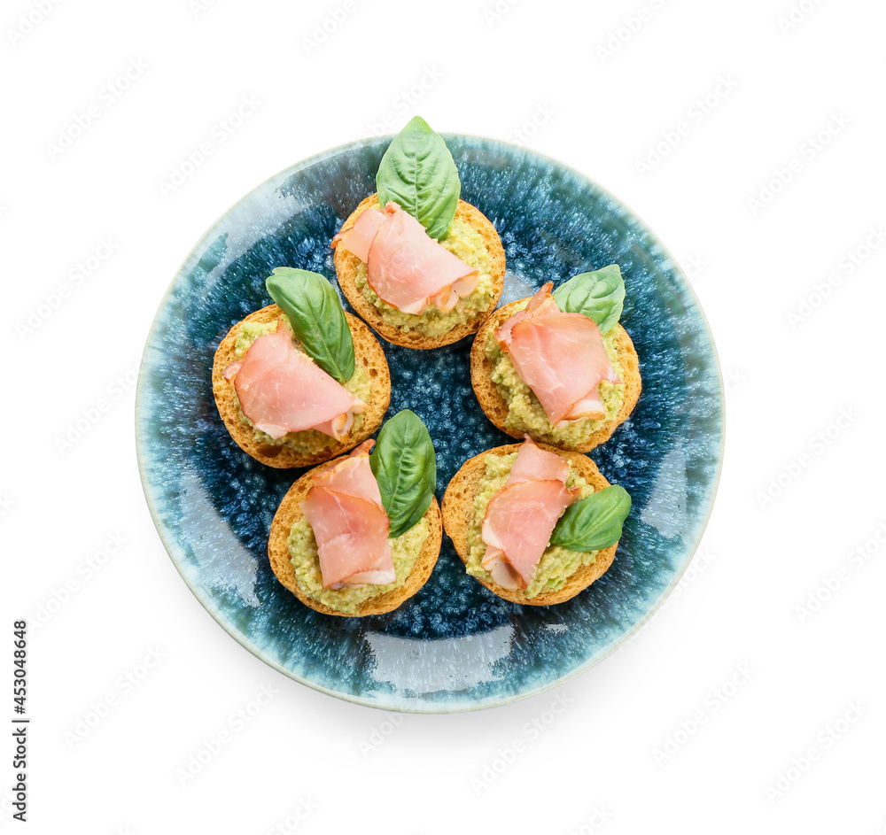 Tasty sandwiches with guacamole and ham on white background