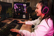 © Drobot Dean - Happy young woman streamer gamer in headphones