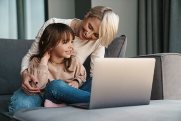 Canvas Print - Happy young mother and her little daughter