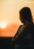 Fototapeta  - portrait of a beautiful teenage girl at sunset