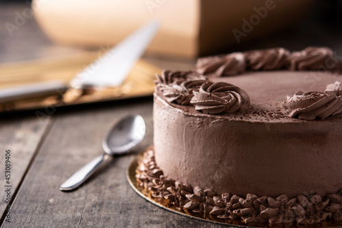 Piece of chocolate truffle cake on wooden table