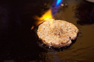 Wall Mural - grilling meat on an iron plate