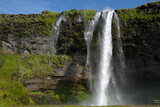 Fototapeta Tęcza - Seljalandsfoss waterfall on the southern coast of Iceland on a sunny day