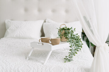 Wall Mural - White bedroom interior, closeup at bed with tray.