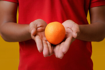 Fresh Orange fruit holding in hand