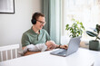 © Johnér - Father holding baby son and working from home