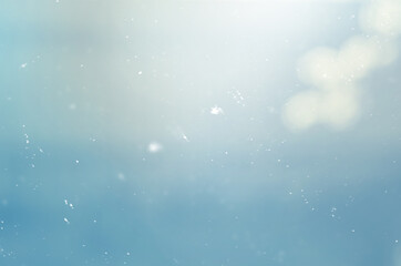Wall Mural - blue abstract background with blurred particles