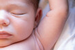 © ADDICTIVE STOCK - Cute newborn sleeping on bed