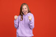 © Lustre Art Group  - Half-length portrait of young happy winner girl isolated on red studio background. Concept of human emotions