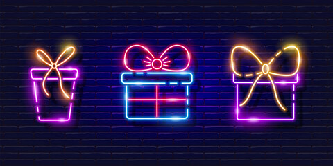 Wall Mural - Gift box neon signs set. Glowing holiday gift icon. New Year and Christmas concept. Vector illustration for design.