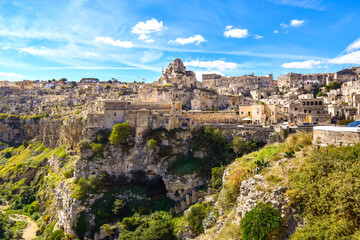 Wall Mural - The steep cliffs and canyons and the ancient Madonna de Idris rock church in the city of Matera, Italy, in the Basilicata region.