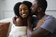 © Creative Flame - Smiling African American couple embracing