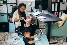 Black Mother Working From Home With Children, Professional Businesswoman