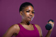 © Creative Flame - Black woman doing workout with dumbbells