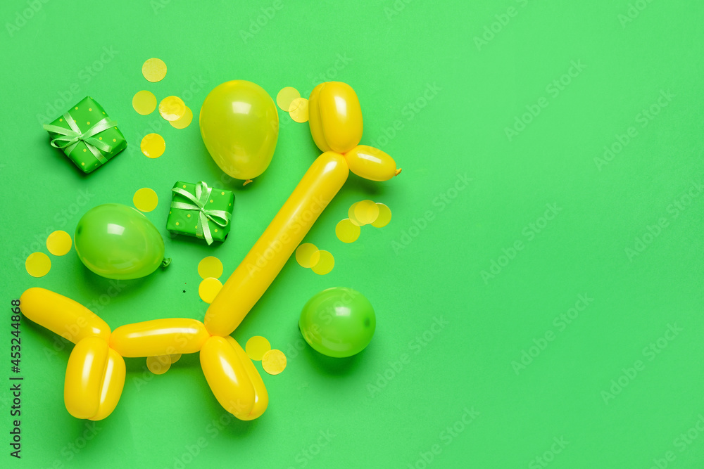 Composition with gift boxes, balloons and confetti on color background