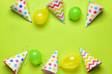 Wall Mural - Party hats, balloons and confetti on color background