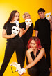 © Marina Chernivetskay - girls in white masks and white gloves in the image of mimes an unseen wall show hands actors of theater and cinema, the concept of advertising a shopping center