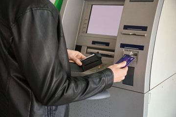 Man withdrawing money from ATM