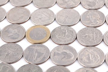 Wall Mural - A Euro coin in a spread out dollar coin