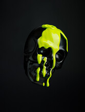 Black Human Skull With Leaking And Dripping Neon Green Paint Isolated On A Black Background. Creative Halloween Or Santa Muerte Concept. Retro Future Aesthetic.