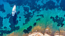 Aerial Drone Top Down Ultra Wide Photo Of Luxury Yacht Anchored In Tropical Exotic Island Bay With Crystal Clear Turquoise Sea