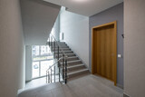 Fototapeta Morze - Modern interior of new entrance in residential building.