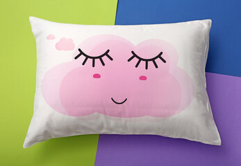 Poster - Soft pillow with cute face on color background, top view