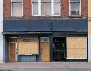 Closed business with boarded up windows